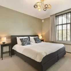 Art Deco plafondlamp goud met smoke en amber glas